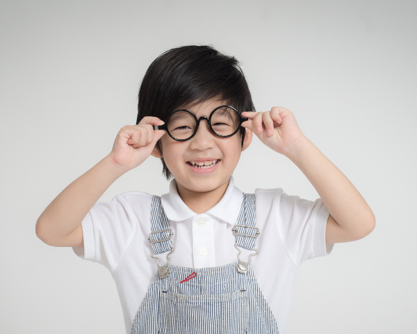 Boy wearing glasses and smiling