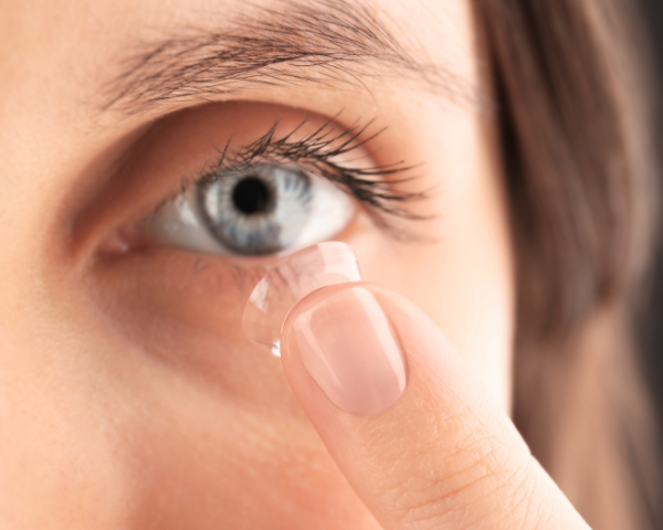 Person inserting a contact lens