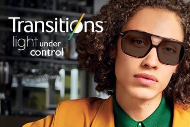 male model wearing glasses with transitions lenses