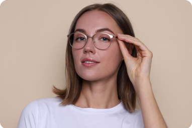 woman trying on glasses