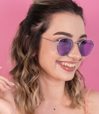 image of brunette girl wearing purple sunglasses