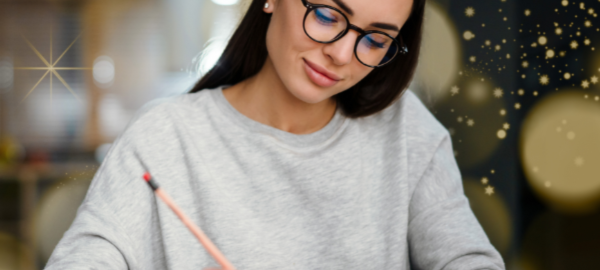 woman wearing glasses writing a list
