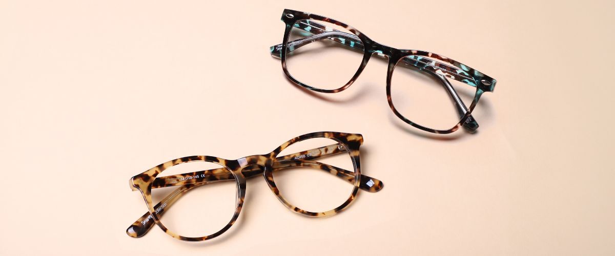 flatlay of two pairs of tortoiseshell glasses