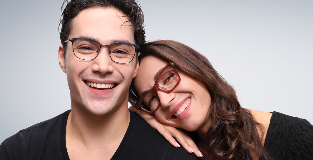 a male and a female model, both wearing glasses