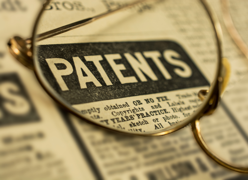 "patent" text in a newspaper with a pair of glasses sitting on top