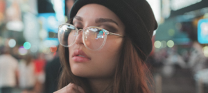 girl posing wearing clear frame oversized glasses