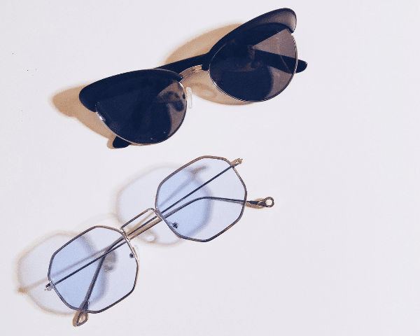 regular galsses and polarized sunglasses on flat surface