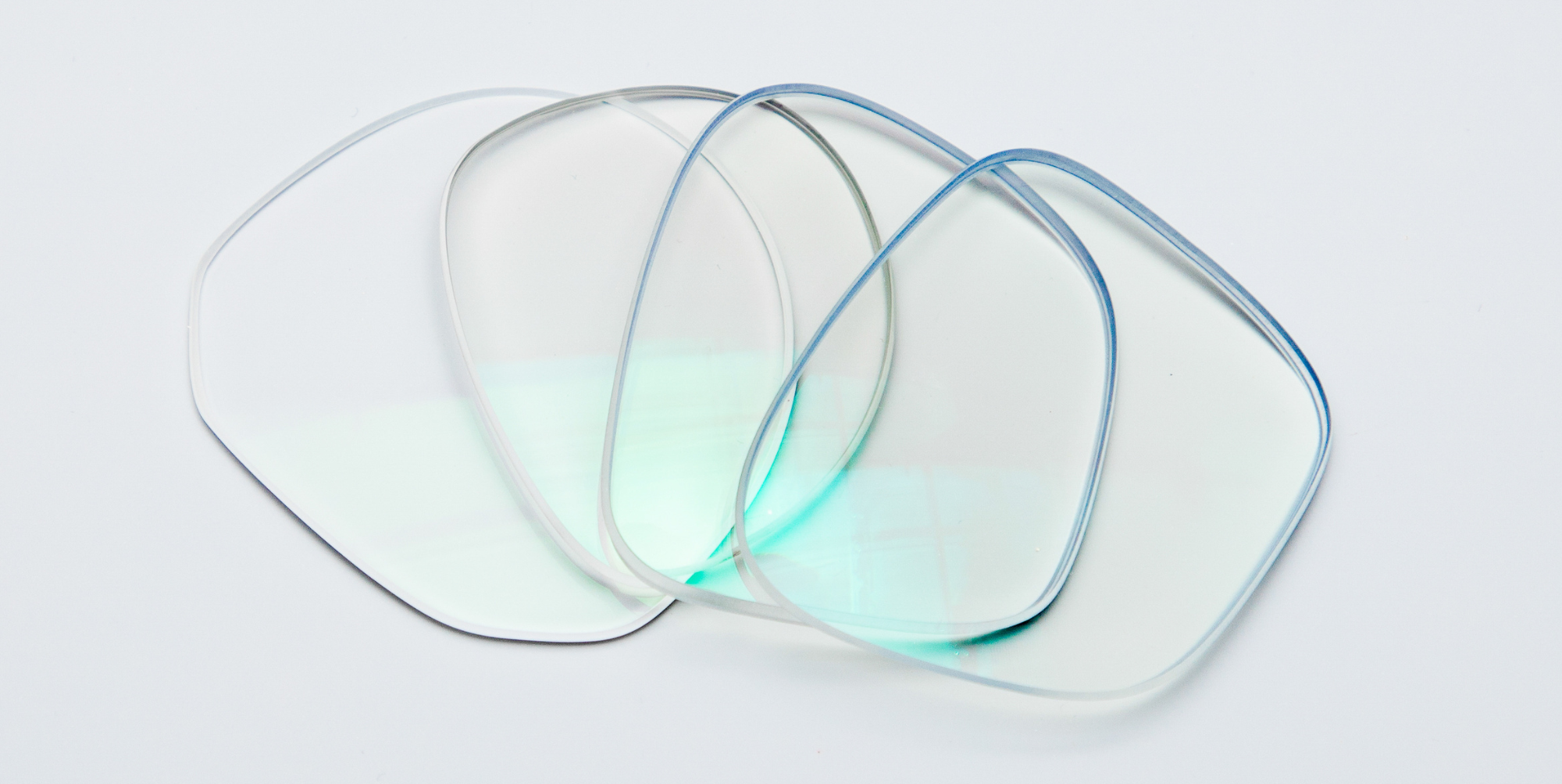 four glasses lenses on a white background