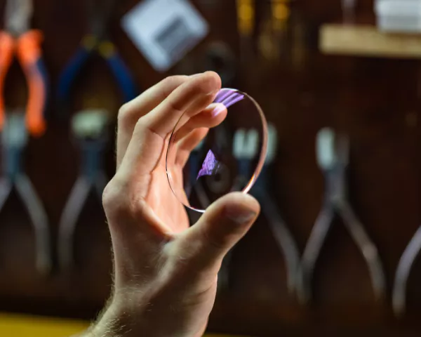 hand holding up lens