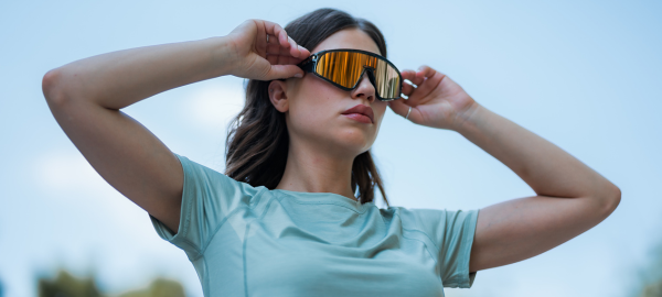 Model wearing mirrored sunglasses