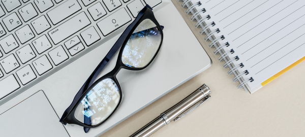 computer glasses on top of laptop