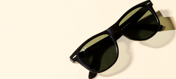 Black sunglasses frames with white background.