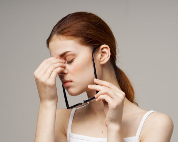 woman having uncomfortable glasses