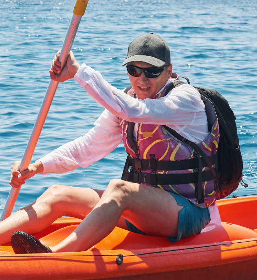 man in sports sunglasses doing water sports