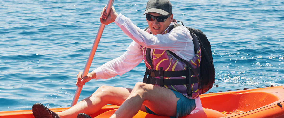 man in sports sunglasses doing water sports