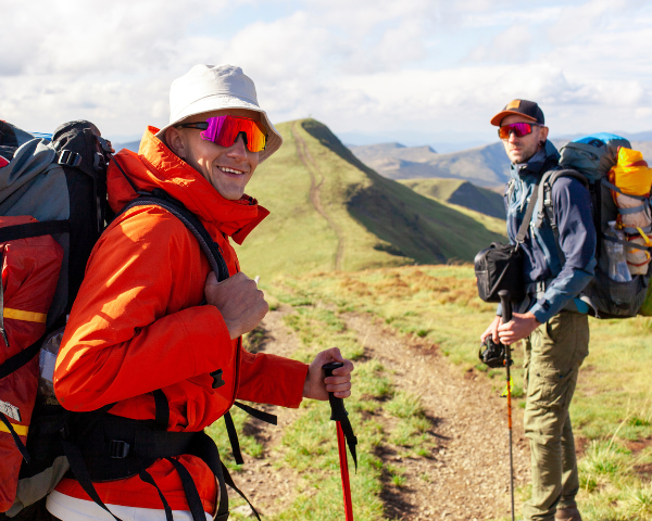 two men hiking wearing sports sunglasses