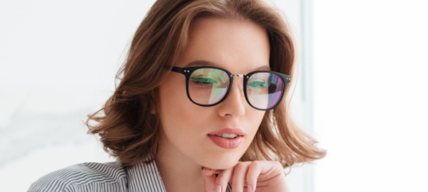 Woman wearing blue light glasses
