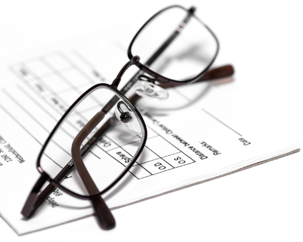 eyeglasses over an eye prescription copy