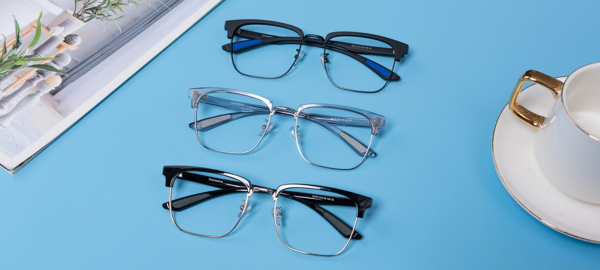 three pairs of browline glasses on a blue background