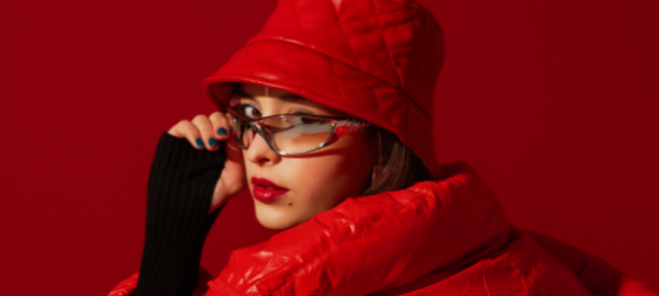 girl in all red clothes wearing reflective glasses