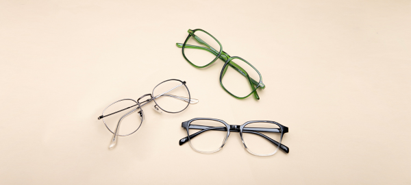 three pairs of eyeglasses on a table