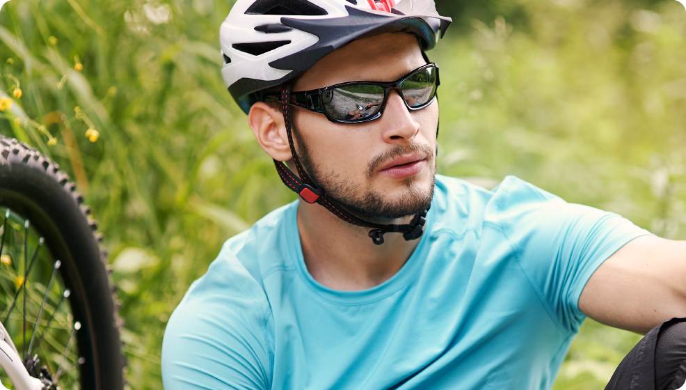 man cycling wearing sunglasses