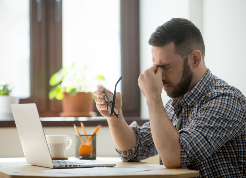 man suffering from digital eye strain