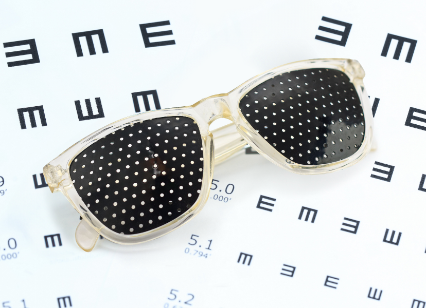 pinhole glasses on an eyechart