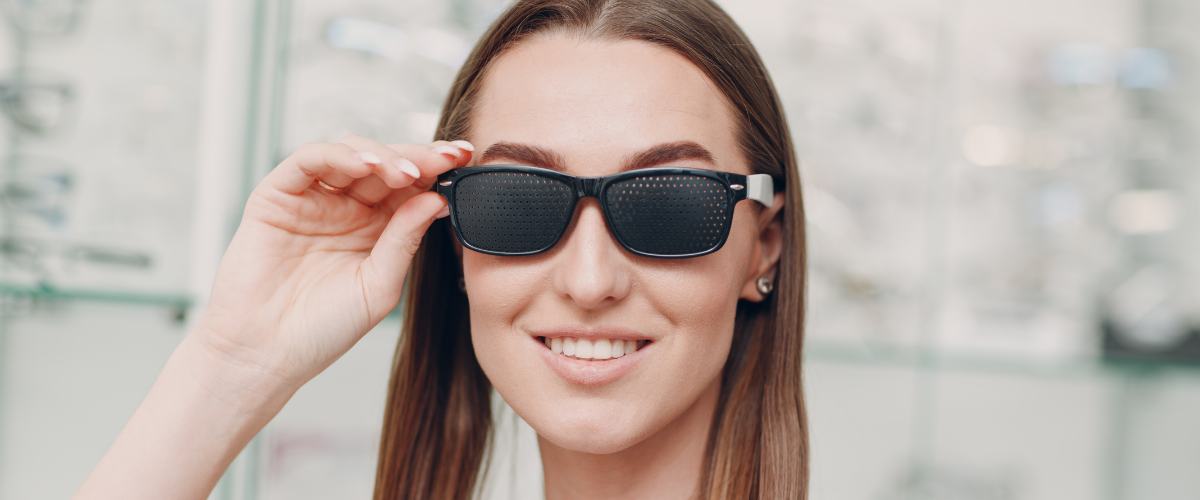 woman wearing pinhole glasses