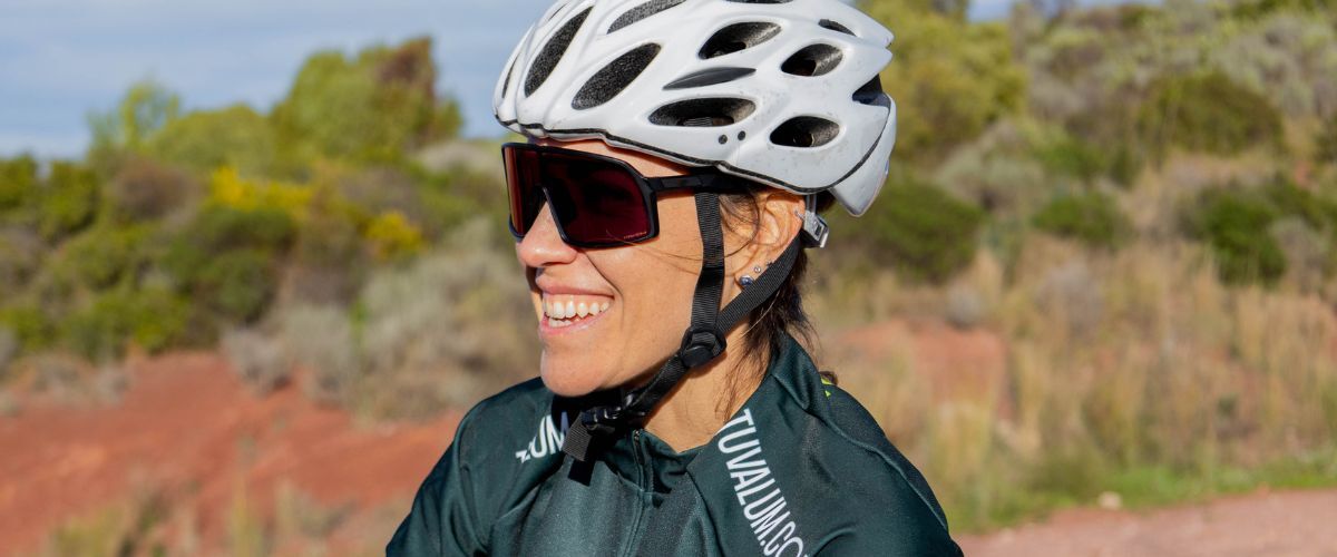 woman wearing bike helmet and sport sunglasses