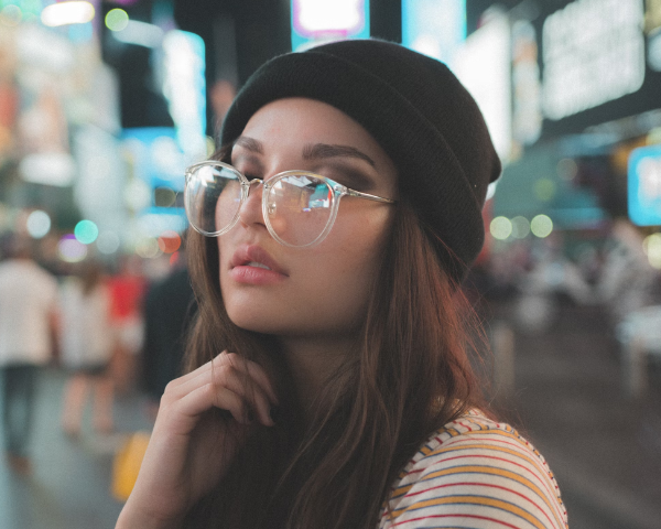 girl posing wearing clear frame oversized glasses