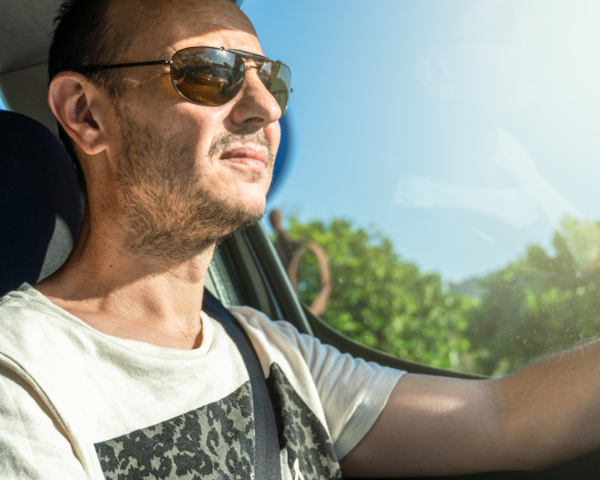 Man wearing polarised lenses while driving during day